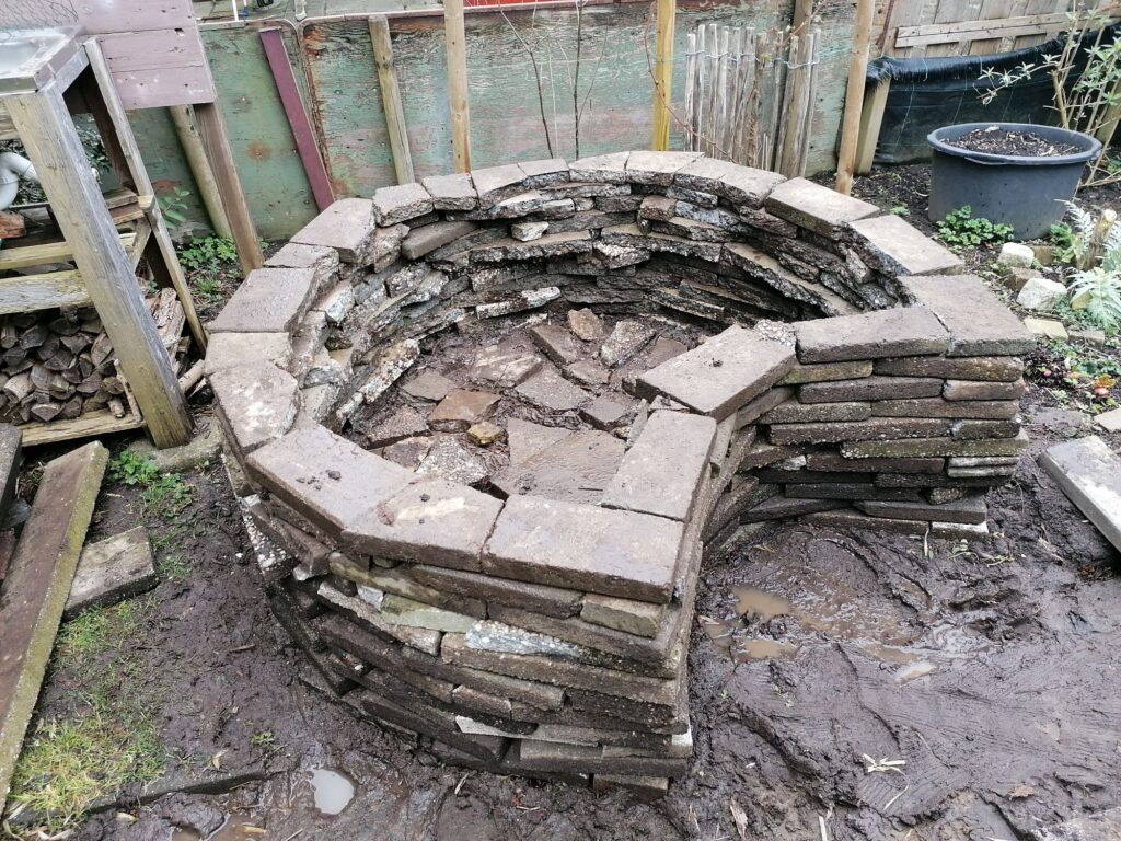 Wall is about 60 cm high. On the floor surface a layer with bricks was laid.